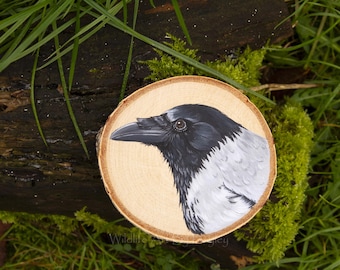 Hooded crow painting on a recycled wood slice