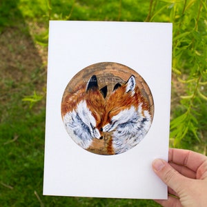 May include: A painting of two foxes cuddling on a wooden background. The foxes are painted in shades of brown, white, and black. The painting is titled "Wildlife Art by Bri Hailey".