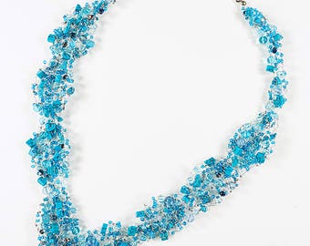 22 inch blue necklace hand-knit with artist wire, turquoise chips and glass beads