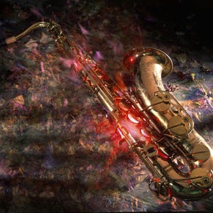 May include: A gold-colored saxophone with a red and purple background. The saxophone is lying on its side with the bell facing the camera.