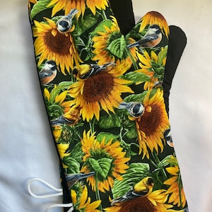 Oven mitts! Sunflowers and blue birds oven mitts! A pair of fully functional, long oven gloves! Adult size