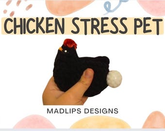 May include: A black crocheted chicken stress pet with a red comb and a white ball tail. The text "CHICKEN STRESS PET" is displayed above the chicken. The brand name "MADLIPS DESIGNS" is below the chicken.