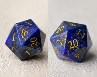 May include: A blue 20-sided die made of lapis lazuli with gold numbers. The die is a polyhedron with 20 sides and is used in tabletop role-playing games.