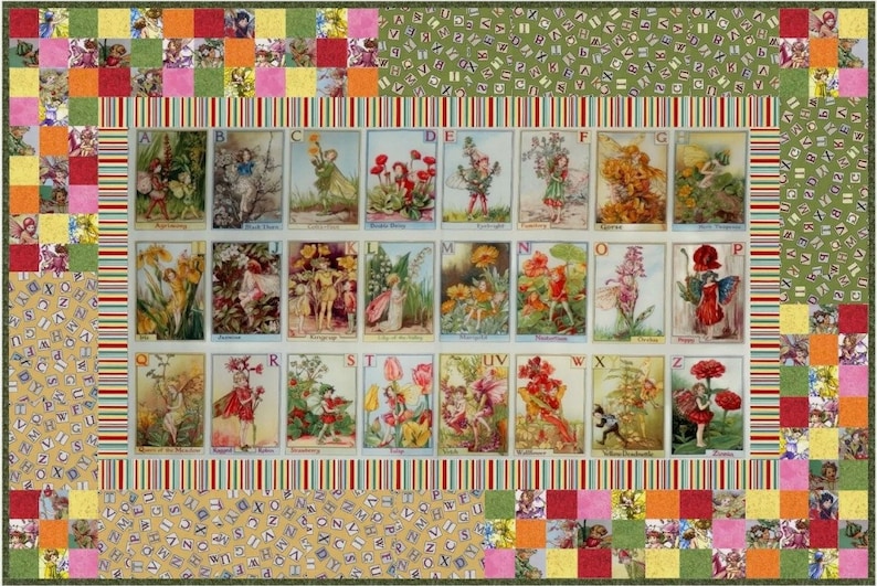 May include: A colorful quilt featuring a patchwork design with a central panel of alphabet cards depicting fairies and flowers. The cards are surrounded by a border of green, yellow, and red squares with a repeating pattern of letters.
