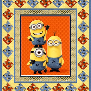 May include: A colorful quilt featuring the Minions characters. The central image shows three Minions on an orange background. The quilt has a yellow border with blue and red diamond patterns, and a blue border with Minion patterns.