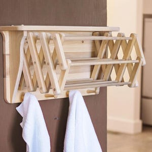 Wall Mount Drying Rack. Mounts on wall to save space while still being able to dry clothes. Space saver