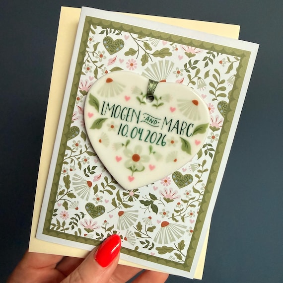 A wedding card that ships with an actual ceramic heart — the keepsake outlives the envelope by decades.