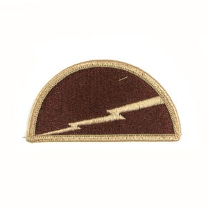 May include: A brown felt patch with a tan border in the shape of a half circle. A tan lightning bolt design is embroidered on the patch.