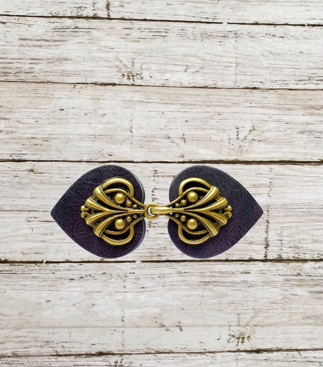 Cinch Clip Waist Cincher Bronze on Dark Blue Leather Dress Clips Cloak