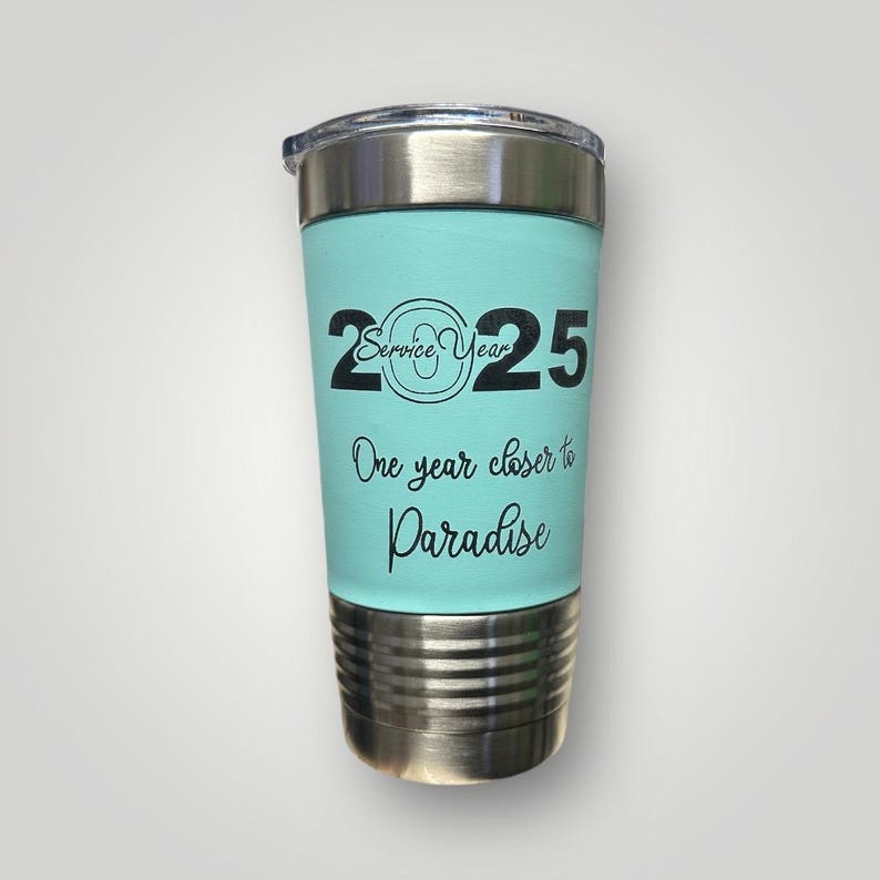 May include: A turquoise stainless steel tumbler with a black inscription that reads "2025 Service Year One year closer to Paradise".