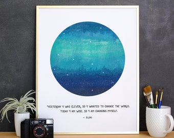 May include: A framed print with a watercolor painting of a blue and green circle with white stars. The quote "Yesterday I was clever, so I wanted to change the world. Today I am wise, so I am changing myself. - Rumi" is printed below the painting.