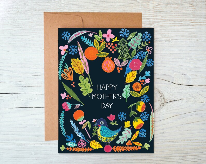 May include: A black card with a colorful floral design and the text "Happy Mother's Day". The card features a blue bird with a yellow beak and a pink flower.