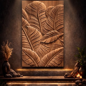Könnte beinhalten: Rechteckige Holz-Wandpaneel mit einem Relief aus tropischen Blättern. Die Blätter sind mit detaillierten Adern versehen und in einer geschichteten Anordnung angeordnet. Das Paneel hat eine warme braune Farbe, mit dem Text "3D Wall Panel STL/ Tropical Leaf CNC Model" unten.