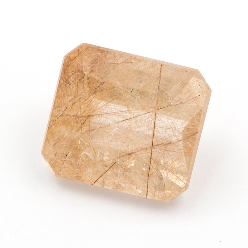weight Measurements 14.25 x 12.71 x 8.61 mm. 12.05 ct Rectangular emerald-cut natural rutilated quartz