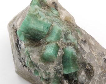 345 gram raw emerald with quartz and mica matrix.