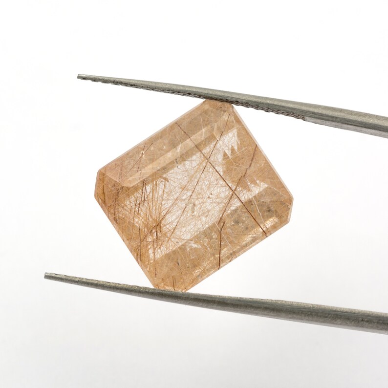weight Measurements 14.25 x 12.71 x 8.61 mm. 12.05 ct Rectangular emerald-cut natural rutilated quartz