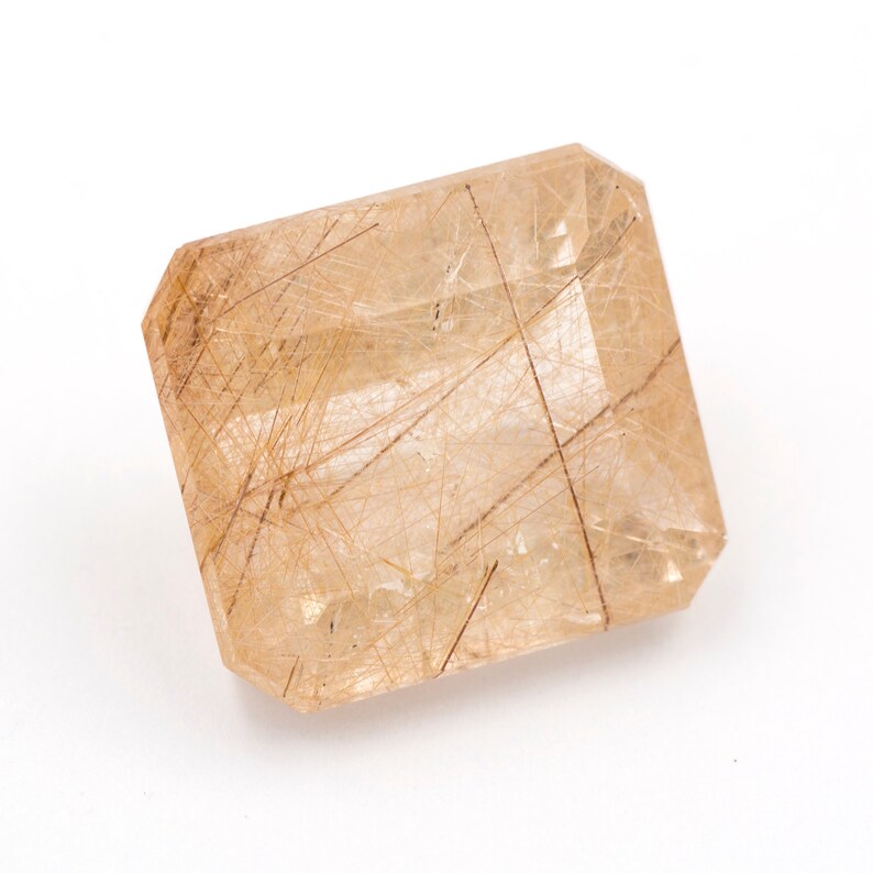 weight Measurements 14.25 x 12.71 x 8.61 mm. 12.05 ct Rectangular emerald-cut natural rutilated quartz