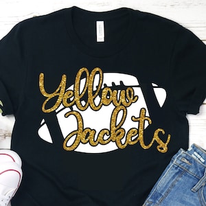 May include: Black t-shirt with a white football graphic and the text "Yellow Jackets" in gold glitter lettering.