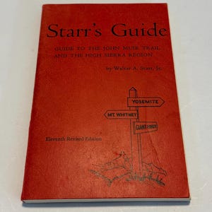 May include: A vintage red book titled "Starr's Guide" with black text. The cover features a signpost pointing to Yosemite, Mt. Whitney, and Giant Forest. The book is a guide to the John Muir Trail and High Sierra Region.