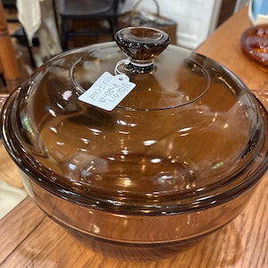 May include: A set of three ceramic mugs with a speckled, matte finish. The mugs are in shades of cream, light gray, and dark gray. Each mug has a simple, minimalist design, perfect for coffee or tea.