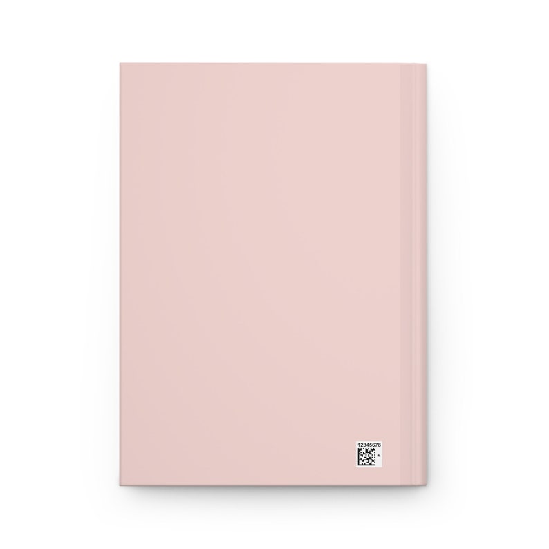 May include: A blush pink notebook with a blank cover and a small barcode sticker on the back.