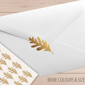 May include: White envelope with a gold leaf design and a sheet of matching stickers. The text "MORE COLOURS & SIZES" is visible. The Confetti Barn logo is in the upper left corner.