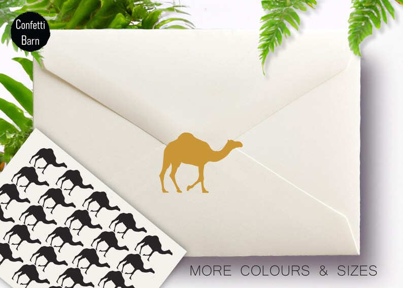 May include: A white envelope with a gold camel silhouette on the front. A sheet of paper with multiple black camel silhouettes is in the bottom left corner. The text "MORE COLOURS & SIZES" is at the bottom right corner of the envelope.