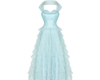 May include: A light blue tulle dress with a sweetheart neckline and multiple layers of ruffles.