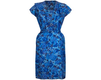 May include: A blue floral print dress with a v-neck, short sleeves, and a belt at the waist.