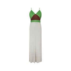May include: A floor-length dress with a color-blocked bodice. The top features a green, brown, and green design with spaghetti straps. The skirt is a solid light gray color. The dress is made of a soft, flowing fabric.