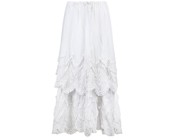 May include: A white tiered skirt with a ruffled hem. The skirt is made of a lightweight fabric and has a drawstring waist.
