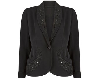 May include: A black blazer with a fitted silhouette and a collar and pockets trimmed with black beading.