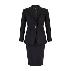 May include: A black skirt suit, consisting of a tailored blazer and a knee-length skirt. The blazer features a single-button closure, notched lapels, and two front pockets. The skirt is a classic pencil style. The suit is made of a solid black fabric.