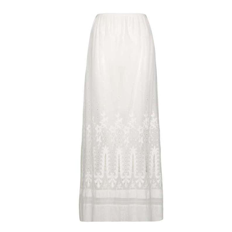 May include: White cotton skirt with embroidered floral details. The skirt has a full, flowing silhouette and a delicate lace trim.