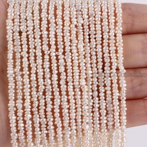May include: A strand of white freshwater pearls, each pearl is irregular in shape and has a slightly off-white color. The pearls are strung on a clear thread and are approximately 4mm in size.