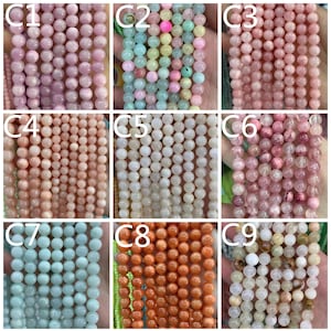 Puede incluir: Nueve hilos de cuentas de piedras preciosas en varios colores. Las cuentas son redondas y parecen tener aproximadamente 6 mm de di&aacute;metro. Los colores incluyen rosa claro, verde, melocot&oacute;n, blanco, naranja y una mezcla de rosa y rojo.