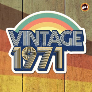 May include: Vintage 1971 graphic with a rainbow arc and a blue background. The text is in a retro font style.