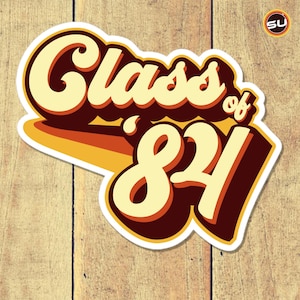 May include: A white sticker with a retro-style design that says "Class of '84" in brown, yellow, and orange lettering.