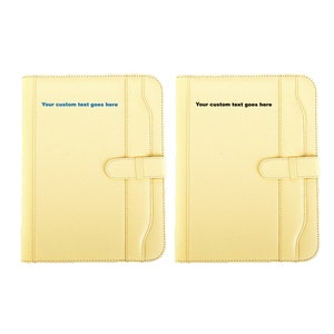 May include: Two yellow leather folders with a flap closure and a stitched design. The text "Your custom text goes here" is printed on each folder.