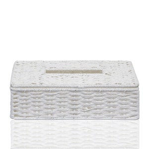 May include: White woven wicker tissue box cover. The cover has a rectangular shape with a slot for tissues in the top.