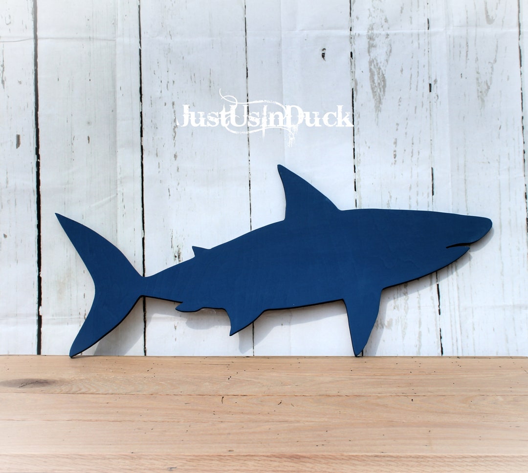 Detailed carved wooden shark wall hanging.