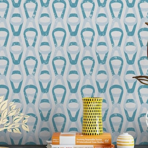 May include: A blue and white geometric patterned wallpaper with a distressed look. The wallpaper features a repeating pattern of overlapping circles and ovals. A yellow vase with black polka dots sits on a shelf in front of the wallpaper.