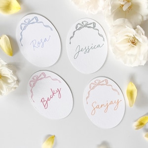 Ovale plaatskaarten strik, pastelkleurige plaatskaarten bruiloft, plaatskaartjes vrijgezellenfeest, schattige plaatskaarten lint, plaatskaartjes lint vrijgezellenfeest