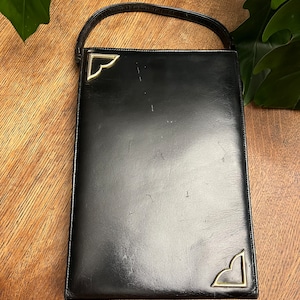 Monedero vintage con asa superior