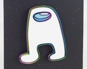May include: A white Among Us character pin with a holographic outline and a blue visor, standing on a black card with a starry background. A white speech bubble above the character says "AMOGUS".