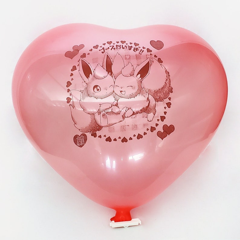 May include: A pink heart-shaped balloon with a printed image of two Eevee Pokemon characters hugging. The balloon has the Japanese text "Eevee I love you!" printed on it.