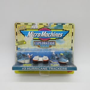 May include: Micro Machines Exploration Sea set featuring #3 Hurricane Trackers. The package includes several small, blue and white toy boats and helicopters. The packaging has a map design and the words "Aqua-Action Features".