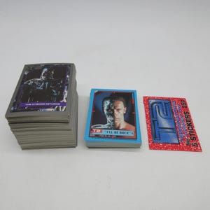 Conjunto completo de 140 cards do Exterminador do Futuro 2 de 1991 + 44 adesivos + embalagem - Topps - Card não esportivo - Nonsport T2