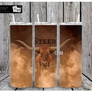 May include: Three stainless steel tumblers with a brown and white design featuring a steer with the word "STEER" and the word "CLEAR" on the tumblers.