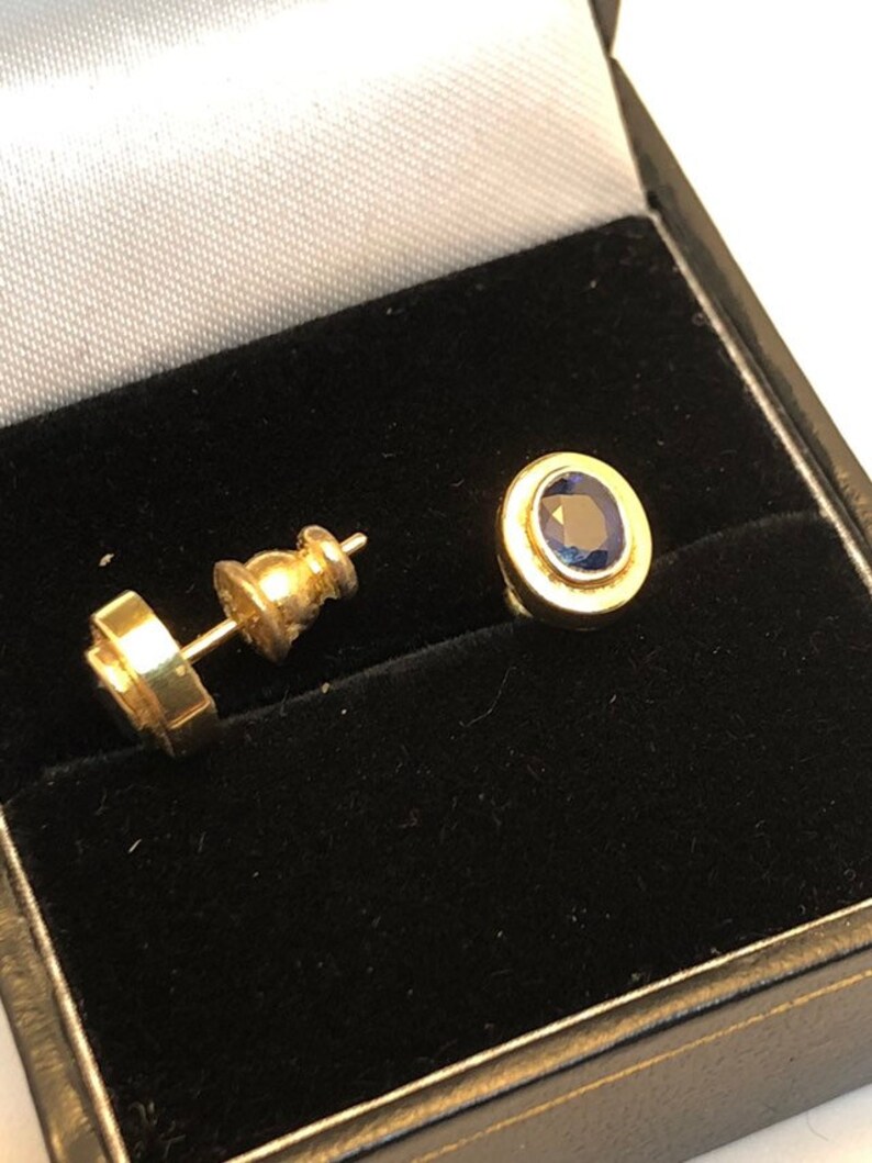 18 carat gold blue sapphire stud earrings 8 millimetres long